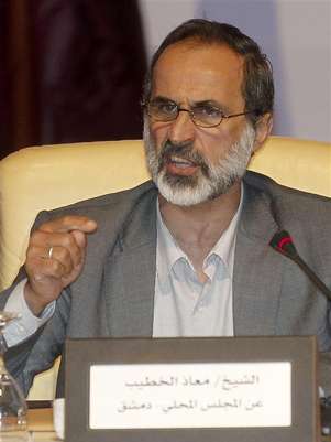 Activist preacher Mouaz al-Khatib speaks the General Assembly of the Syrian National Council in Doha November 11, 2012. Foto: Mohammed Dabbous / Reuters