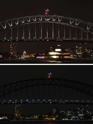 Combinação de fotografias mostra a Harbour Bridge, de Sydney (Austrália), antes e durante a Hora do Planeta Foto: AFP