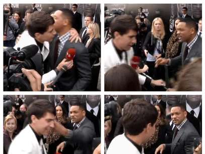 Esta serie de fotografías, tomada de un video de la AP, muestra el momento en que el actor estadounidense Wil Smith recibe un abrazo del reportero Vitali Sediuk y lo abofetea después de que el periodista trató de besarlo, el viernes 18 de mayo de 2012, antes del estreno de "Men in Black III", en Moscú   Foto: ia AP video / AP