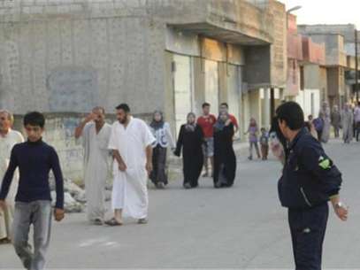 Residents flee their homes after a shelling in Houla, near Homs, June 18, 2012. Foto: Handout / Reuters In English