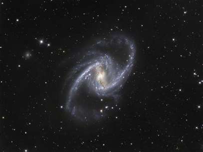 The NGC 1365 galaxy, also known as the Great Barred Spiral Galaxy, is seen in an image that combines observations performed through three different filters with the 1.5-metre Danish telescope at the European Southern Observatory (ESO) in Chile, in this handout photo distributed on September 22, 2010. Foto: Handout / Reuters In English