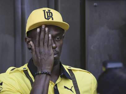 El velocista jamaicano Usain Bolt posa para un fotógrafo tras una conferencia de prensa el jueves, 26 de julio de 2012, en la antesala de los Juegos Olímpicos de Londres.  Foto: Ben Curtis / AP
