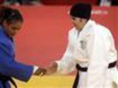 
              The first Saudi Arabian woman to compete in the Olympics was easily defeated Friday by a Puerto Rican opponent in a judo bout that lasted only 82 seconds. (Aug. 3)   
             Foto: AP in English
