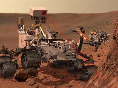 This artist's concept depicts the rover Curiosity, of NASA's Mars Science Laboratory mission, as it uses its Chemistry and Camera (ChemCam) instrument to investigate the composition of a rock surface. Foto: Handout / Reuters In English