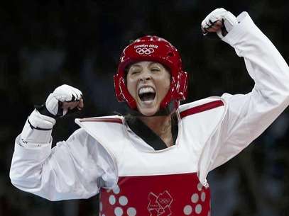 Gold medallist Britain's Jade Jones poses at the women's -57kg taekwondo victory ceremony at the London 2012 Olympic Games at the ExCeL arena August 9, 2012. Foto: Kim Kyung-Hoon / Reuters In English