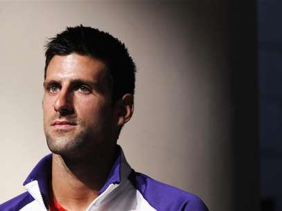 2011 US Open champion Novak Djokovic of Serbia listens to speakers during the US Open tournament draw ceremony at the Billie Jean King National Tennis Center in New York August 23, 2012. Foto: Lucas Jackson / Reuters In English