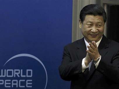 Chinese Vice President Xi Jinping arrives for the opening ceremony of the World Peace Forum held in Beijing in this July 7, 2012 file photo. Foto: Files / Reuters In English