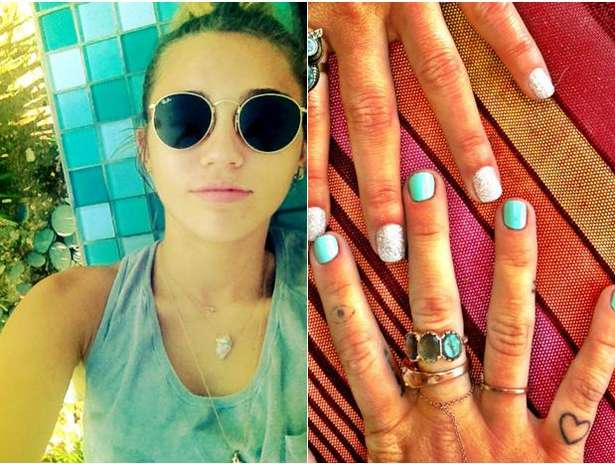 Miley se dibuja un punto negro rodeado por un círculo en el dedo índice en marzo de 2012.  El tatuaje es de un amuleto turco de nombre Nazar, para la protección  del mal de ojo y las malas miradas.  Foto: Twitter
