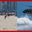 Helicóptero faz 'chover' dinheiro em praia de Santa Catarina
