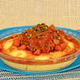 Frango ao molho com polenta na panela de pressão para o jantar