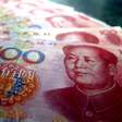 China avança na adoção do yuan digital com adesão de 26 bancos em plataforma de transações internacionais do e-CNY
