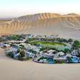 Essa pequena vila no Peru fica escondida entre dunas gigantescas, tem um oásis natural e parece literalmente uma miragem no meio do deserto