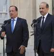 Hollande fala com jornalistas ao fim de encontro com o líder da Coalizão Nacional Síria, Ahmad al-Jarba, em Paris  Foto: AP