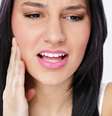 A ATM (articulação temporomandibular) liga a mandíbula ao crânio, além de ser responsável por todos os movimentos dos maxilares e da boca, como mastigação, deglutição e fala  Foto: Shutterstock