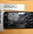 <p>Imagem divulgada pela polícia mostra o telefone destruído pelo tiro</p>  Foto: AP
