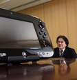 <p>Presidente da Nintendo, Satoru Iwata, é visto ao lado do controle do console Wii U</p>  Foto: Yuriko Nakao / Reuters
