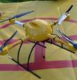 <p>Drone da DHL possui quatro hélices</p>  Foto: AFP