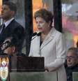 <p>A presidente Dilma Rousseff discursa durante a despedida de Mandela</p>  Foto: AFP