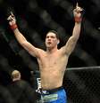 <p>Após defender o cinturão pela primeira vez, Chris Weidman subiu três posições no ranking</p>  Foto: Reuters