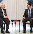 Assad reunido com o chanceler sírio, Javad Zarif  Foto: AP
