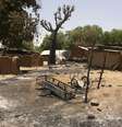 <p>Casas incendiadas na vila Buni Gari na Nig&eacute;ria&nbsp;</p>  Foto: Reuters