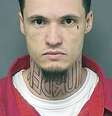 Foto sem data mostra Jeffrey Chapman, acusado de assassinato e sua tatuagem "murder"  Foto: AP