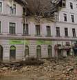 Um carro foi atingido pelos escombros do prédio e ficou parcialmente enterrado em Viena  Foto: Reuters