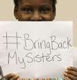 <p>A estudante Deborah Peter, sobrevivente do ataque do grupo Boko Haram em 2011, segura um cartaz escrito "Traga de volta&nbsp;as minhas&nbsp;irm&atilde;s"</p><p>&nbsp;</p>  Foto: Reuters