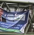 <p>Pessoas caminham ao lado de banner de candidato presidencial. Segundo os resultados divulgados, Sissi teve uma vit&oacute;ria esmagadora sobre Sabahi&nbsp;</p>  Foto: Reuters