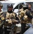 <p>Membros das For&ccedil;as de Opera&ccedil;&otilde;es Especiais iraquianas montam&nbsp;guarda no distrito de Amiriya, em Bagd&aacute;, em 18 de junho</p>  Foto: Reuters