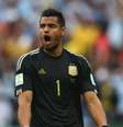 <p>Logo atrás de Navas, de Costa Rica, Romero é goleiro menos vazado da Copa</p>  Foto: Ronald Martinez / Getty Images 