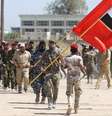 <p>Volunt&aacute;rios xiitas do Hezbollah&nbsp;marcham ao se juntarem ao ex&eacute;rcito iraquiano, para combater os militantes jihadistas do Estado Isl&acirc;mico (EI), anteriormente conhecido como o Estado Isl&acirc;mico do Iraque e do Levante (EIIL), nesta quarta-feira, 9 de julho, em Bagd&aacute;</p>  Foto: Ahmad al-RUBAYE / AFP