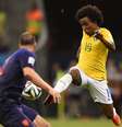 <p>Willian tenta passar por Ron Vlaar</p>  Foto: FABRICE COFFRINI / AFP