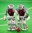 Robôs disputam a bola na RoboCup no Irã, em abril de 2014  Foto: AFP