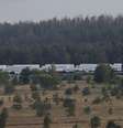 <p>Caminh&otilde;es de um comboio russo que transportam ajuda humanit&aacute;ria para a Ucr&acirc;nia&nbsp;estacionados na base a&eacute;rea militar nos arredores de Voronezh, em 13 de agosto</p>  Foto: Maxim Shemetov  / Reuters
