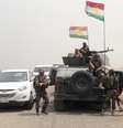 <p>Combatentes curdos ficam de guarda na Represa de Mossul, no norte do Iraque, em 19 de agosto</p>  Foto: Reuters