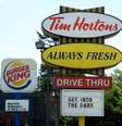 <p>Uma placa da rede&nbsp;Burger King e da Tim Hortons s&atilde;o exibidas em St. Laurent Boulevard, em Ottawa, no Canad&aacute;, em 25 de agosto</p>  Foto: he Canadian Press, Sean Kilpatrick / AP