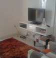 <p>Detalhe do móvel branco e do tapete: tudo novo na sala do Bruno!</p>  Foto: vc repórter