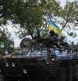 <p>Homens das forças de segurança ucraniana fazem ronda em Kramatorsk, Ucrânia, em 11 de setembro</p>  Foto: 