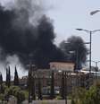 <p>Fumaça sobe de uma área onde rebeldes xiitas lutam contra as forças do governo em Sanaa, em 21 de setembro </p>  Foto: Khaled Abdullah / Reuters
