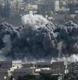 <p>Fumaça na cidade síria de Kobane, vista de perto da travessia de fronteira Turquia-Síria</p>  Foto: Umit Bektas / Reuters