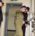 <p>Lee Joon-seok, capitão da balsa sul-coreana Sewol, chega ao Tribunal do Distrito de Gwangju, na Coreia do Sul, em 27 de outubro</p>  Foto: Yonhap/ Park Chul-hong / AP