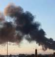 Fumaça é vista em área de conflito em Benghazi, na Líbia. 23/12/2014.  Foto: Esam Omran Al-Fetori / Reuters