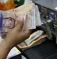 <p>Mercado deve "fixar" taxa de câmbio na Venezuela, segundo autoridades</p>  Foto: Carlos Garcia Rawlins / Reuters