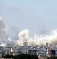 Foto tirada do lado turco da fronteira mostra fumaça sobre a cidade turca de Kobani, em 27 de junho  Foto: Reuters