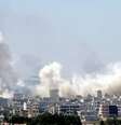 Fumaça é vista em cidade síria de Kobani, em foto tirada do lado turco da fronteira perto de Suruc. 27/6/2015.  Foto: Stringer / Reuters