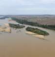 A lama vinda das barragens da Samarco com rejeitos de mineração seguem ao longo do leito do Rio Doce em direção à sua foz, localizada em Regência, Linhares  Foto: Fred Loureiro/Secom ES / Fotos Públicas