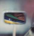 Senna pelo retrovisor de seu carro em Suzuka, no GP do Japão, em 1991, onde venceria seu terceiro título mundial. Para seu autor, Ercole Colombo, é o símbolo da exposição: 'É como se Senna olhasse a sua história pelo retrovisor'   Foto: Ercole Colombo