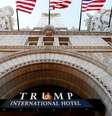 Flags fly above the entrance to the new Trump International Hotel on its opening day in Washington, DC  Foto: BBC News Brasil