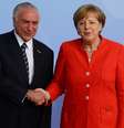 Michel Temer recebe as boas vindas da premiê Angela Merkel na Alemanha  Foto: Reuters